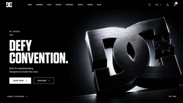 A dark DC Shoes hero webpage with white editorial typography and a large black sculptural 3D DC logo object.